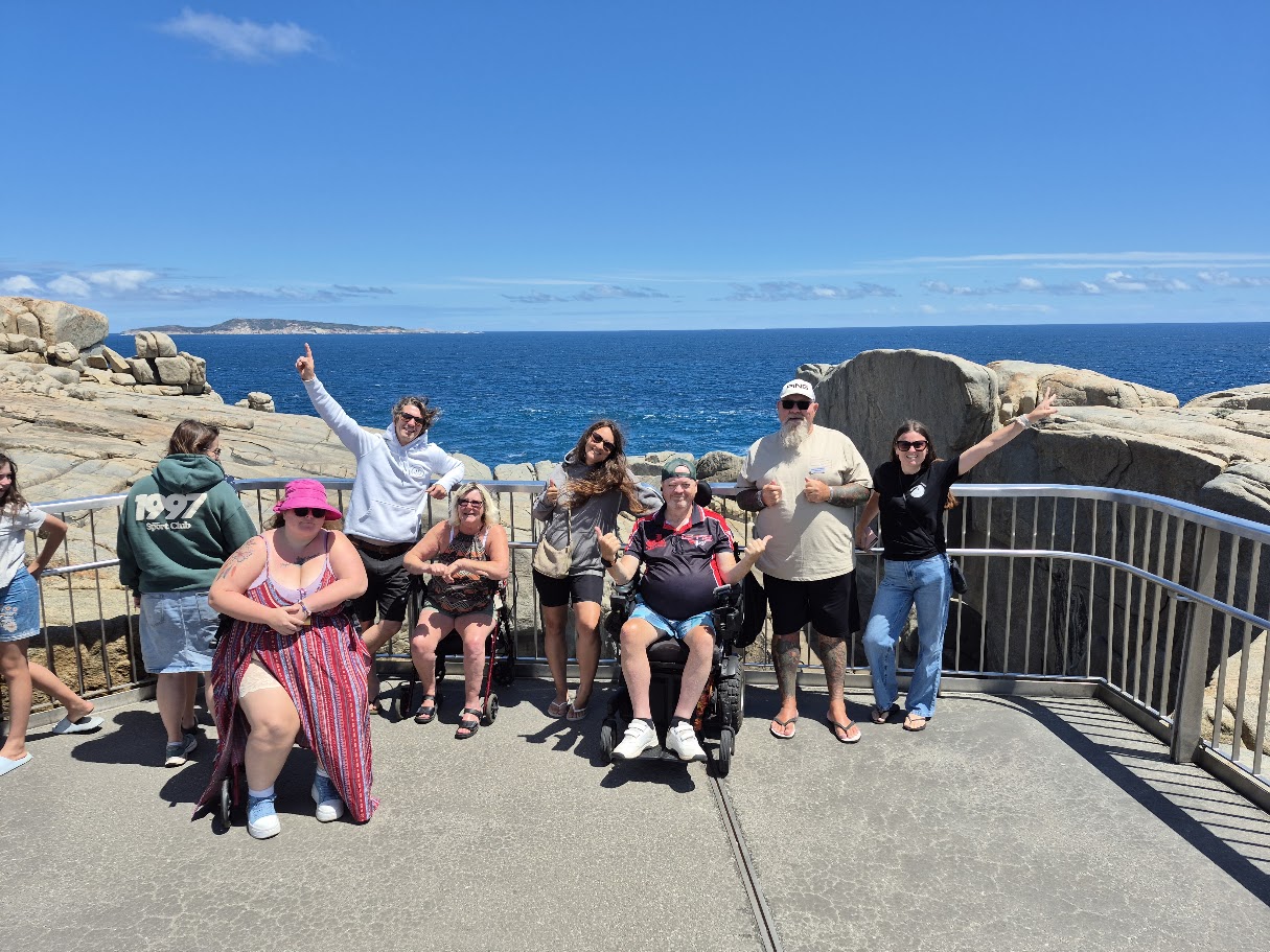 People enjoying a Happiness Crew short break by the coast