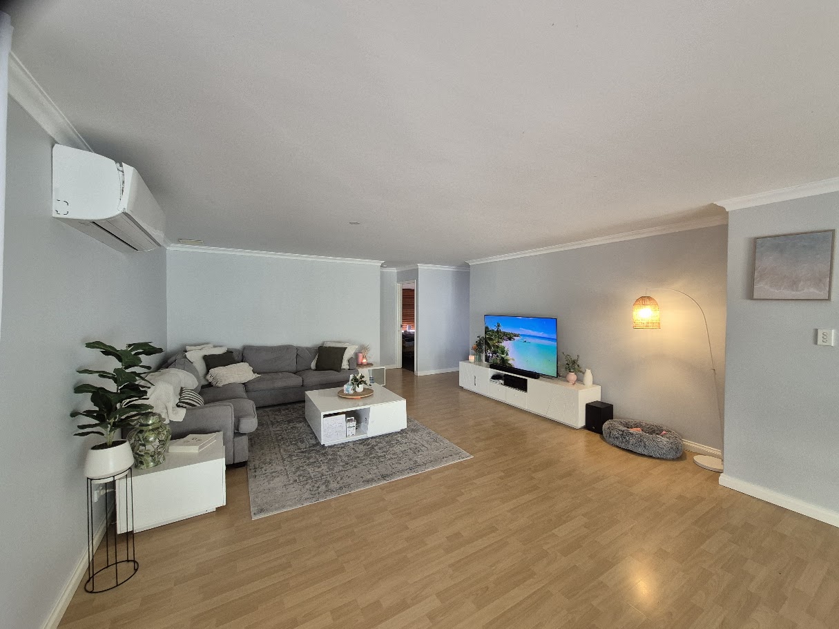 Shared living room at the Happiness Crew Aubin Grove home